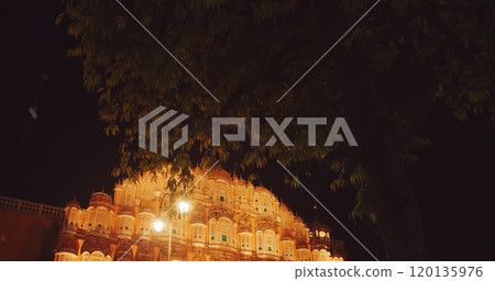 Jaipur, Rajasthan, India. Hawa Mahal Palace In Night Illuminations. Panoramic View Palace Of Winds. Built From Red And Pink Sandstone. Maharaja Sawai Pratap Singh Built Palace In 1799. Very Unique As Jaipur, Rajasthan, India. Hawa Mahal Palace In Night Illuminations. Panoramic View Palace Of Winds. Built From Red And Pink Sandstone. Maharaja Sawai Pratap Singh Built Palace In 1799. Very Unique As 120135976