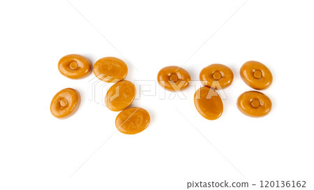 Caramel candies isolated, toffee caramel, round hard milk confectionery, brown sugar candies, small sweets 120136162