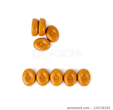 Caramel candies isolated, toffee caramel, round hard milk confectionery, brown sugar candies, small sweets 120136165