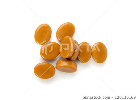 Caramel candies isolated, toffee caramel, round hard milk confectionery, brown sugar candies, small sweets 120136169
