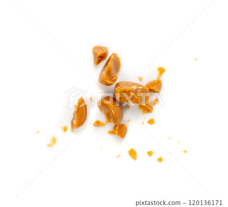 Broken caramel candies isolated, toffee caramel crumbs, round hard milk confectionery pieces Broken caramel candies isolated, toffee caramel crumbs, round hard milk confectionery pieces 120136171