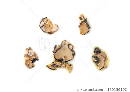 Truffle Slices Isolated, Tuber Melanosporum Mushroom Pieces in Oil, Canned Black Truffle 120136192