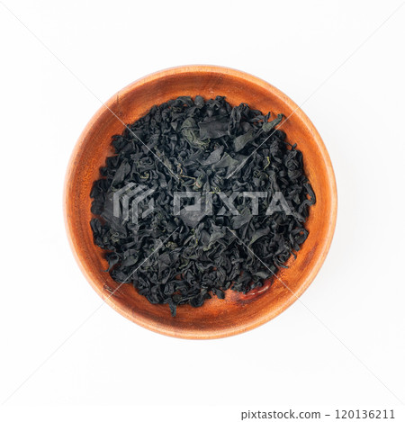 Wakame seaweed pieces isolated, edible raw algae, dry undaria pinnatifida healthy food kelp Wakame seaweed pieces isolated, edible raw algae, dry undaria pinnatifida healthy food kelp 120136211