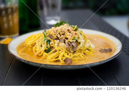 Chiang mai curry noodles, asian spicy egg pasta with meat, curried noodle soup Khao Soi or Khao Sawy, thai?food Chiang mai curry noodles, asian spicy egg pasta with meat, curried noodle soup Khao Soi or Khao Sawy, thai?food 120136246
