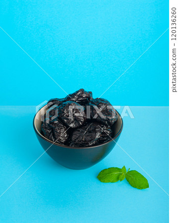 Dry Plums Isolated, Dried Black Fruits, Prune Group, Dry Plum Fruit on White Background Dry Plums Isolated, Dried Black Fruits, Prune Group, Dry Plum Fruit on White Background 120136260