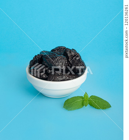Dry Plums Isolated, Dried Black Fruits, Prune Group, Dry Plum Fruit on White Background Dry Plums Isolated, Dried Black Fruits, Prune Group, Dry Plum Fruit on White Background 120136261