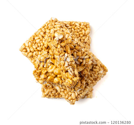 Puffed rice bar isolated, sweet wheat kozinaki, puff cereal block pieces, sugar crispy wheat bar, healthy popped dessert Puffed rice bar isolated, sweet wheat kozinaki, puff cereal block pieces, sugar crispy wheat bar, healthy popped dessert 120136280