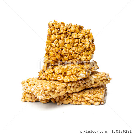 Puffed rice bar isolated, sweet wheat kozinaki, puff cereal block pieces, sugar crispy wheat bar, healthy popped dessert 120136281