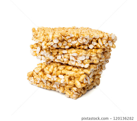Puffed rice bar isolated, sweet wheat kozinaki, puff cereal block pieces, sugar crispy wheat bar, healthy popped dessert Puffed rice bar isolated, sweet wheat kozinaki, puff cereal block pieces, sugar crispy wheat bar, healthy popped dessert 120136282