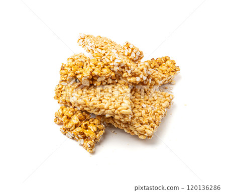 Puffed rice bar isolated, sweet wheat kozinaki, puff cereal block pieces, sugar crispy wheat bar, healthy popped dessert 120136286