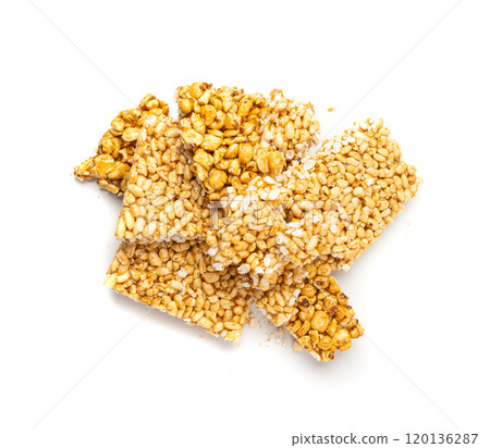 Puffed rice bar isolated, sweet wheat kozinaki, puff cereal block pieces, sugar crispy wheat bar, healthy popped dessert 120136287