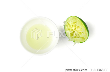 Squeezed lime, squeezing out half green lemon, squeezed lime juice on white background, burnout symbol Squeezed lime, squeezing out half green lemon, squeezed lime juice on white background, burnout symbol 120136312