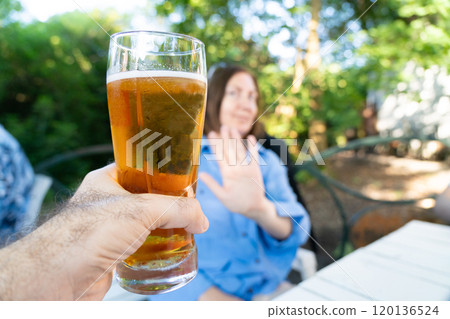 Reject a glass of beer, woman refusing alcohol, stop drinking, sobriety concept, saying no to beer glass 120136524