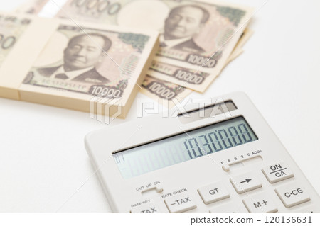 1,030,000 yen and calculator on white background 1,030,000 yen and calculator on white background 120136631