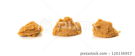 Miso paste isolated. Japanese shiro miso seasoning sauce, fermented soybean spread, brown soy cream Miso paste isolated. Japanese shiro miso seasoning sauce, fermented soybean spread, brown soy cream 120136957