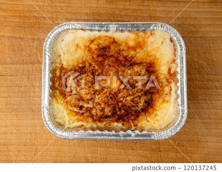 Lasagna portion in aluminium foil tray isolated. Oven baked lasagne for heating, container, airplane food 120137245