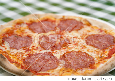 Pepperoni Pizza on Restaurant Plate, Macro Salami Pizza with Tomatoes and Mozzarella Cheese Texture, Selective Focus 120137273