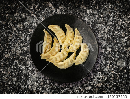 Gyoza Chinese Dumplings Top View, Vegetable Jiaozi, Chicken Momo Pile, Asian Gyoza Portion on Black 120137533