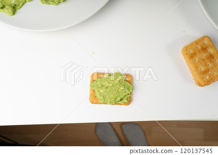 Avocado Smear Toast, Cracker Isolated, Sharwil Puree, Brown Avocados Paste, Fresh Alligator Pear Cream Avocado Smear Toast, Cracker Isolated, Sharwil Puree, Brown Avocados Paste, Fresh Alligator Pear Cream 120137545