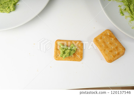 Avocado Smear Toast, Cracker Isolated, Sharwil Puree, Brown Avocados Paste, Fresh Alligator Pear Cream Avocado Smear Toast, Cracker Isolated, Sharwil Puree, Brown Avocados Paste, Fresh Alligator Pear Cream 120137546