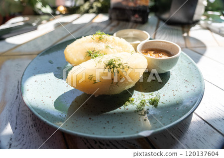 Lithuanian potato dumplings, cepelinai pancakes or kolduny, meat stuffed draniki, traditional didzkukuliai 120137604