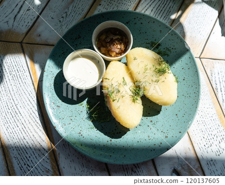 Lithuanian potato dumplings, cepelinai pancakes or kolduny, meat stuffed draniki, traditional didzkukuliai Lithuanian potato dumplings, cepelinai pancakes or kolduny, meat stuffed draniki, traditional didzkukuliai 120137605