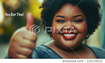 Confident plus size woman giving a thumbs up with a big smile for encouragement and motivation 120139220