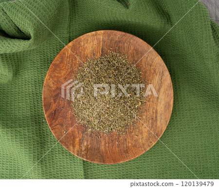 Dry thyme pile, dried marjoram, oregano heap, ground crushed thyme seasoning, thyme leaves 120139479