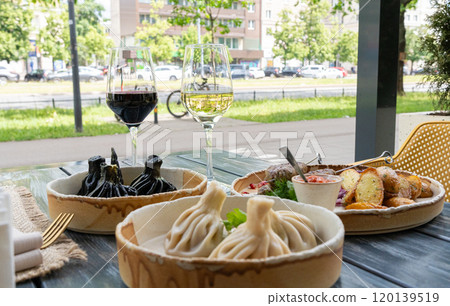 Georgian khinkali, minced meat chinkali, spicy dumplings also called dimsum, momo, jiaozi, manti Georgian khinkali, minced meat chinkali, spicy dumplings also called dimsum, momo, jiaozi, manti 120139519