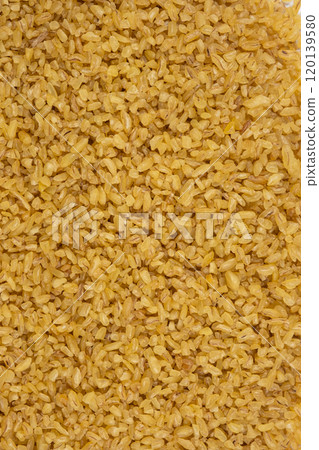 Background of scattered bulgur macro view from above Background of scattered bulgur macro view from above 120139580