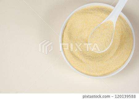 Uncooked durum wheat semolina close-up top view place for text 120139588