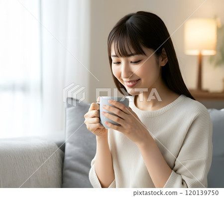 A woman taking a break with a drink A woman taking a break with a drink 120139750