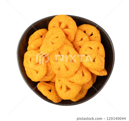 Corn puff snack isolated, crunchy cereal nosh, crispy yellow rice breakfast with paprika Corn puff snack isolated, crunchy cereal nosh, crispy yellow rice breakfast with paprika 120140044
