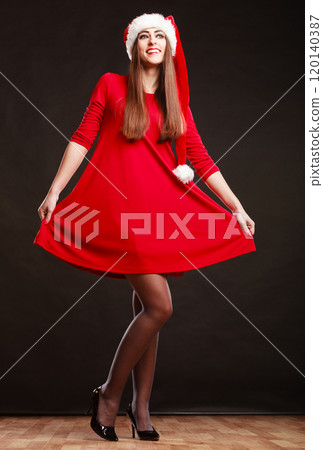 woman wearing santa claus hat on black woman wearing santa claus hat on black 120140387