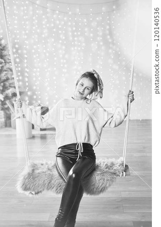 fragile teenage girl surrounded by Christmas lights fragile teenage girl surrounded by Christmas lights 120140536