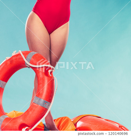 Lifeguard woman on duty with ring buoy lifebuoy. 120140696