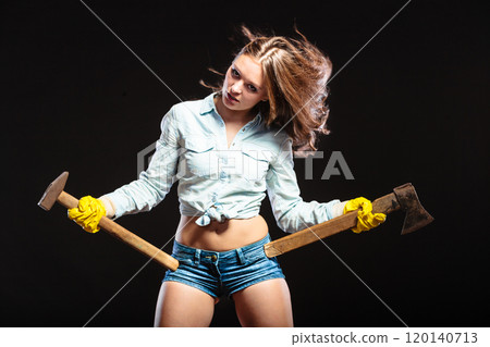 Sexy strong woman feminist with axes working. 120140713