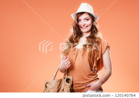 Lovely woman in summer hat handbag portrait 120140764
