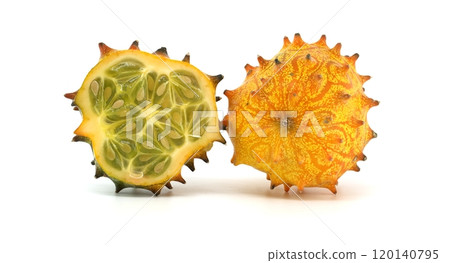 Close-up of vibrant kiwano horned melon with whole and sliced fruit on white background Close-up of vibrant kiwano horned melon with whole and sliced fruit on white background 120140795
