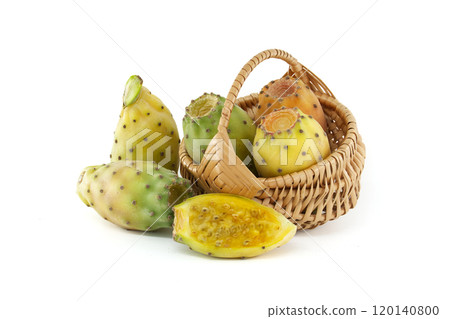 Vibrant prickly pears arranged in a wicker basket on white background, highlighting their vivid hues 120140800