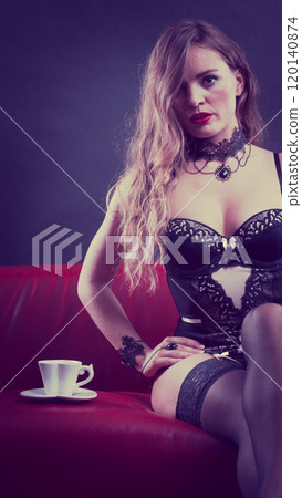 Woman wearing sexy lingerie having coffee cup Woman wearing sexy lingerie having coffee cup 120140874