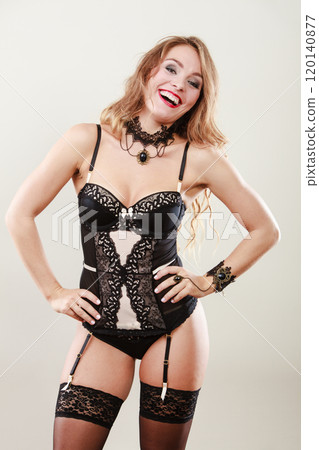 Smiling girl wearing sexy lingerie 120140877