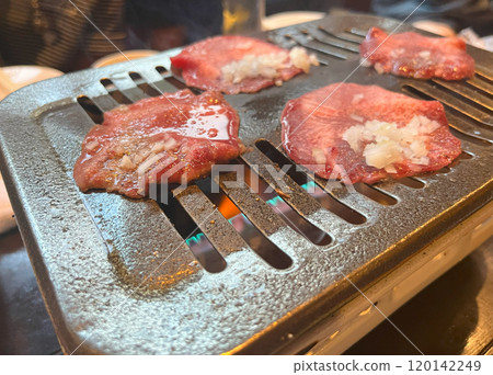 Salted tongue on a hot plate 120142249