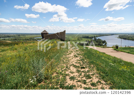 Ancient wooden fortress on a background of river spaces. Russia, Tatarstan, ancient Bulgar fortress in Yelabuga 120142396