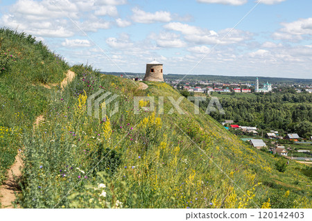 The tower of an ancient Bulgarian fortress on a high cliff on the banks of the Kama River, Elabuga, Tatarstan, Russian Federation 120142403