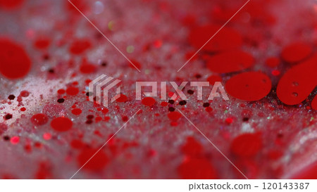 Sparkling bubbles. Glitter paint mix. Blur red color shiny sequin particles ink drops transparent gel fluid spill abstract art background with bokeh lights. 120143387