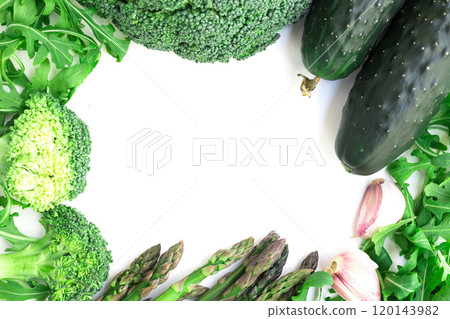 Frame of green vegetables broccoli, arugula, cucumber, asparagus and garlic on white background Frame of green vegetables broccoli, arugula, cucumber, asparagus and garlic on white background 120143982