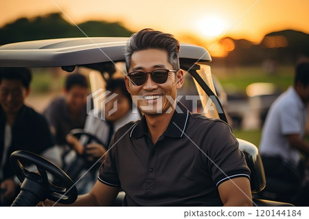 A happy man of Asian appearance is elegantly dressed against the background of a golf cart. A happy man of Asian appearance is elegantly dressed against the background of a golf cart. 120144184