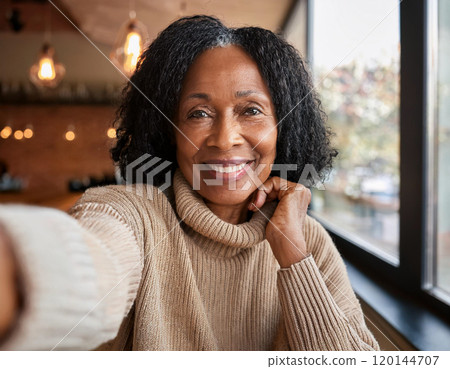 Happy Moments in Coffee Shop Mature Woman Influencer Vlogging or Taking Selfie in Coffee Shop 120144707