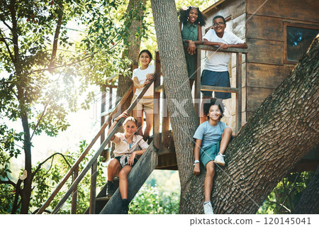 The countdown to summer camp is over. Shot of a group of teenagers standing next to a treehouse at summer camp. The countdown to summer camp is over. Shot of a group of teenagers standing next to a treehouse at summer camp. 120145041